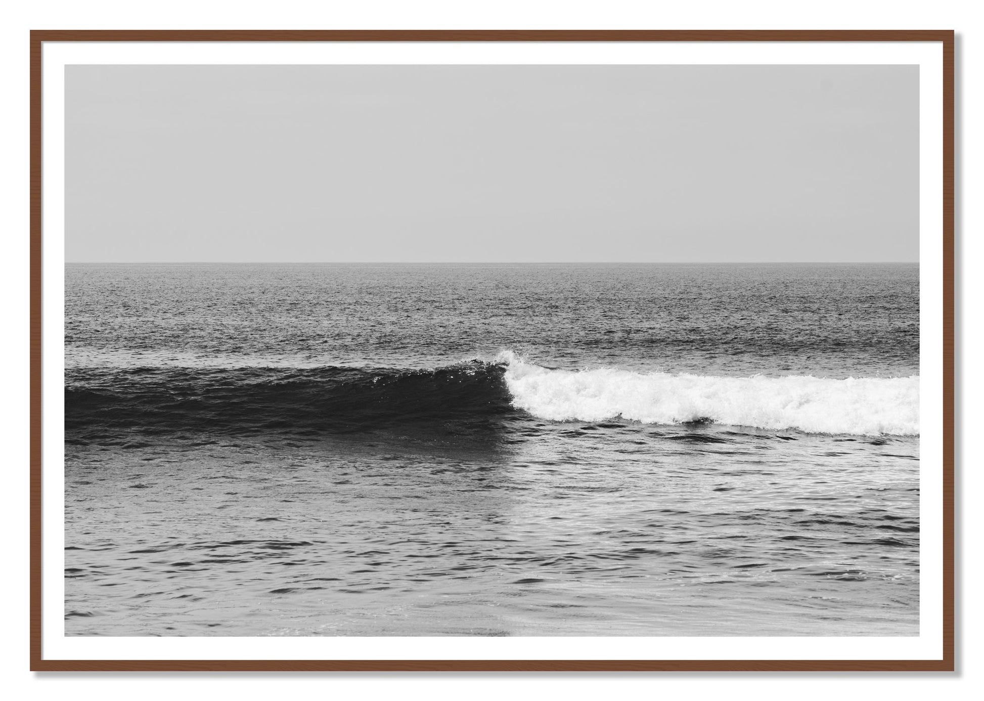 Framed photograph of The Wave by Dylan Ozanich, Walnut frame, Borders