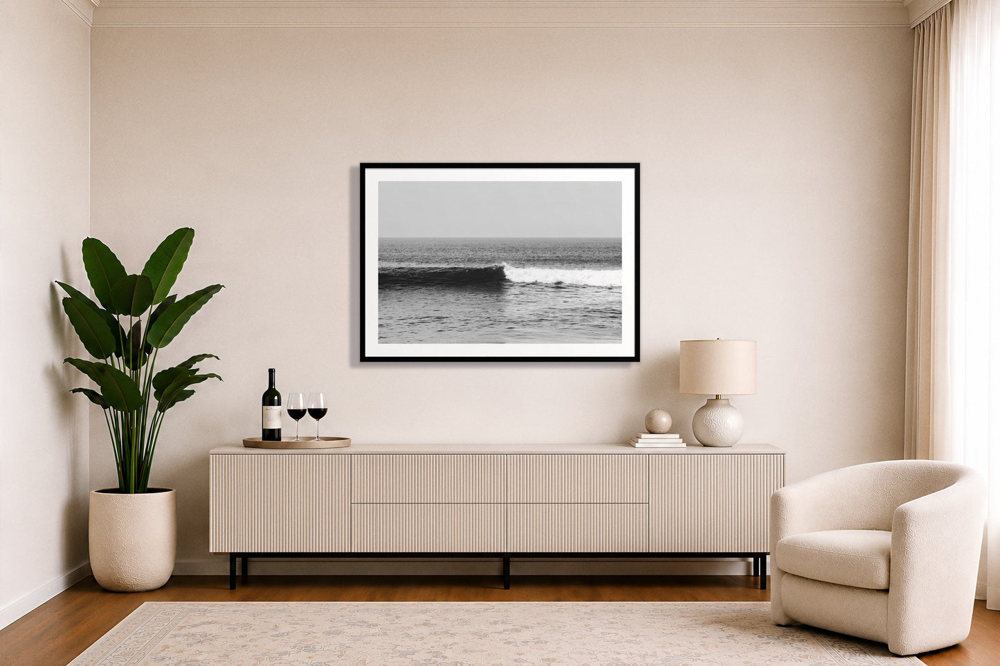 The Wave by Dylan Ozanich in a White frame, above a white fluted credenza in a soft neutral living room