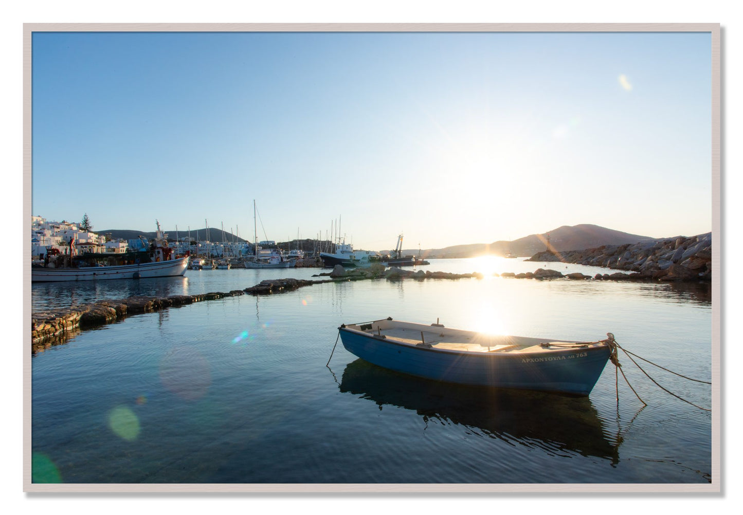 Framed photograph of Tied Down In Paros by Dylan Ozanich, White Maple frame, Full Bleed