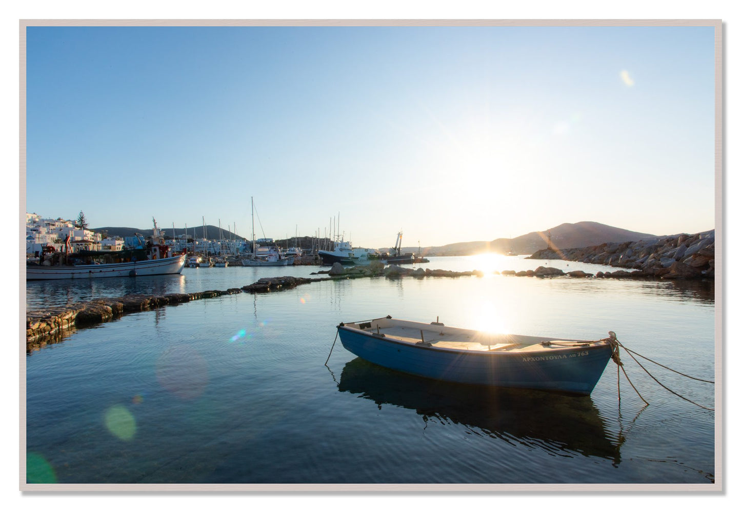 Framed photograph of Tied Down In Paros by Dylan Ozanich, White Maple frame, Full Bleed