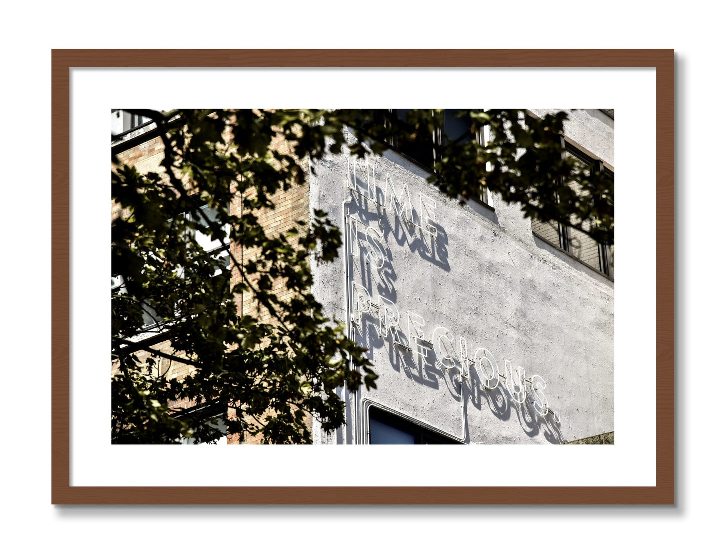Framed photograph of Time Is Precious by Dylan Ozanich, Walnut frame, Borders