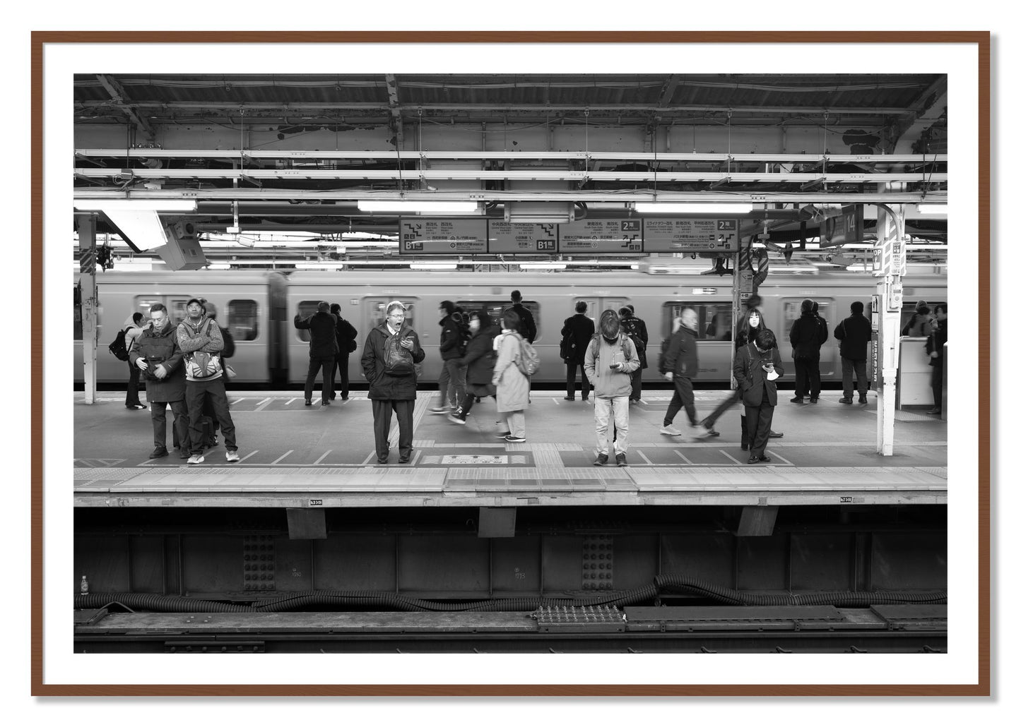 Framed photograph of Tokyo Subway by Dylan Ozanich, Walnut frame, Borders