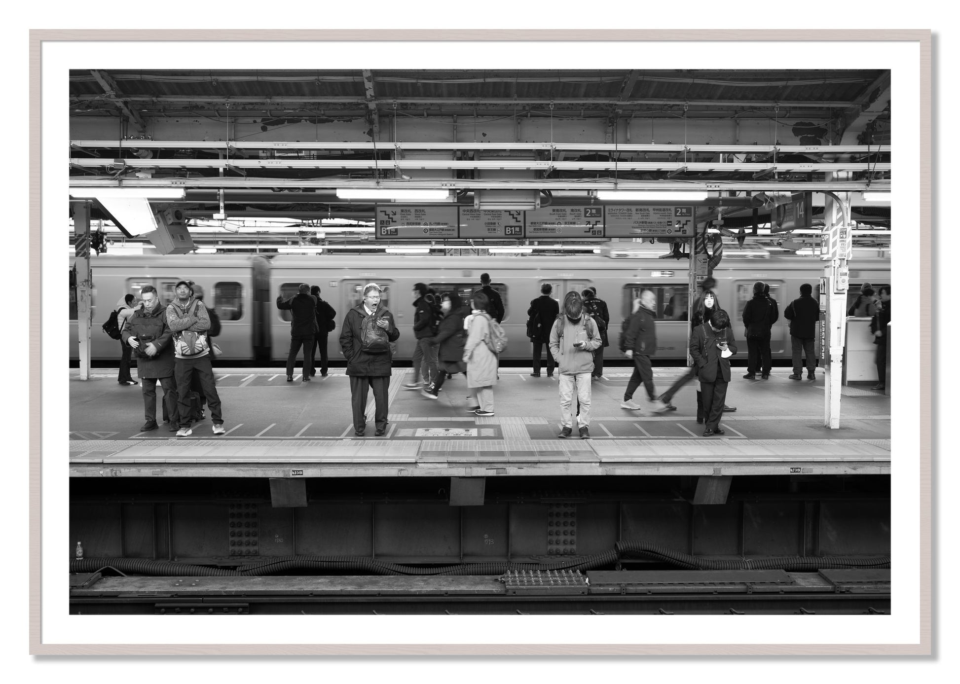 Framed photograph of Tokyo Subway by Dylan Ozanich, White Maple frame, Borders