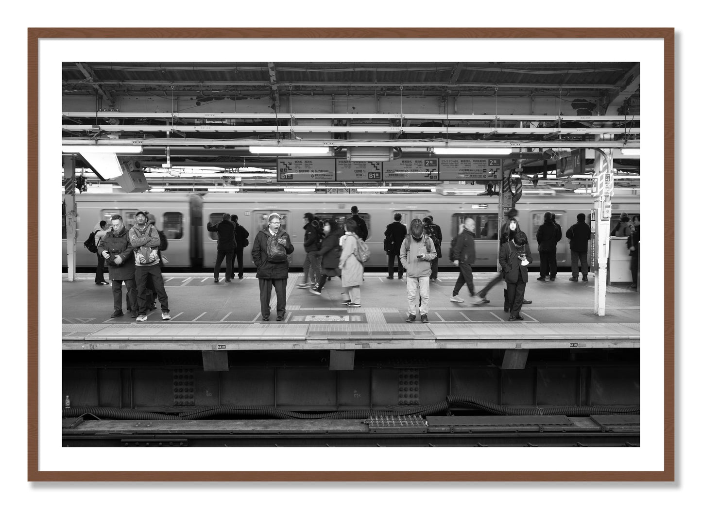 Framed photograph of Tokyo Subway by Dylan Ozanich, Walnut frame, Borders