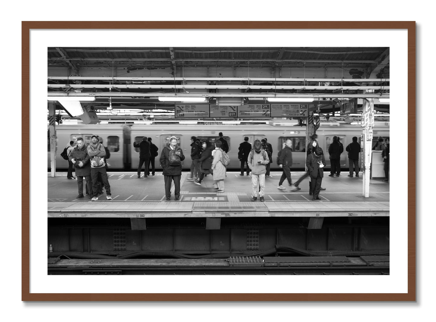 Framed photograph of Tokyo Subway by Dylan Ozanich, Walnut frame, Borders