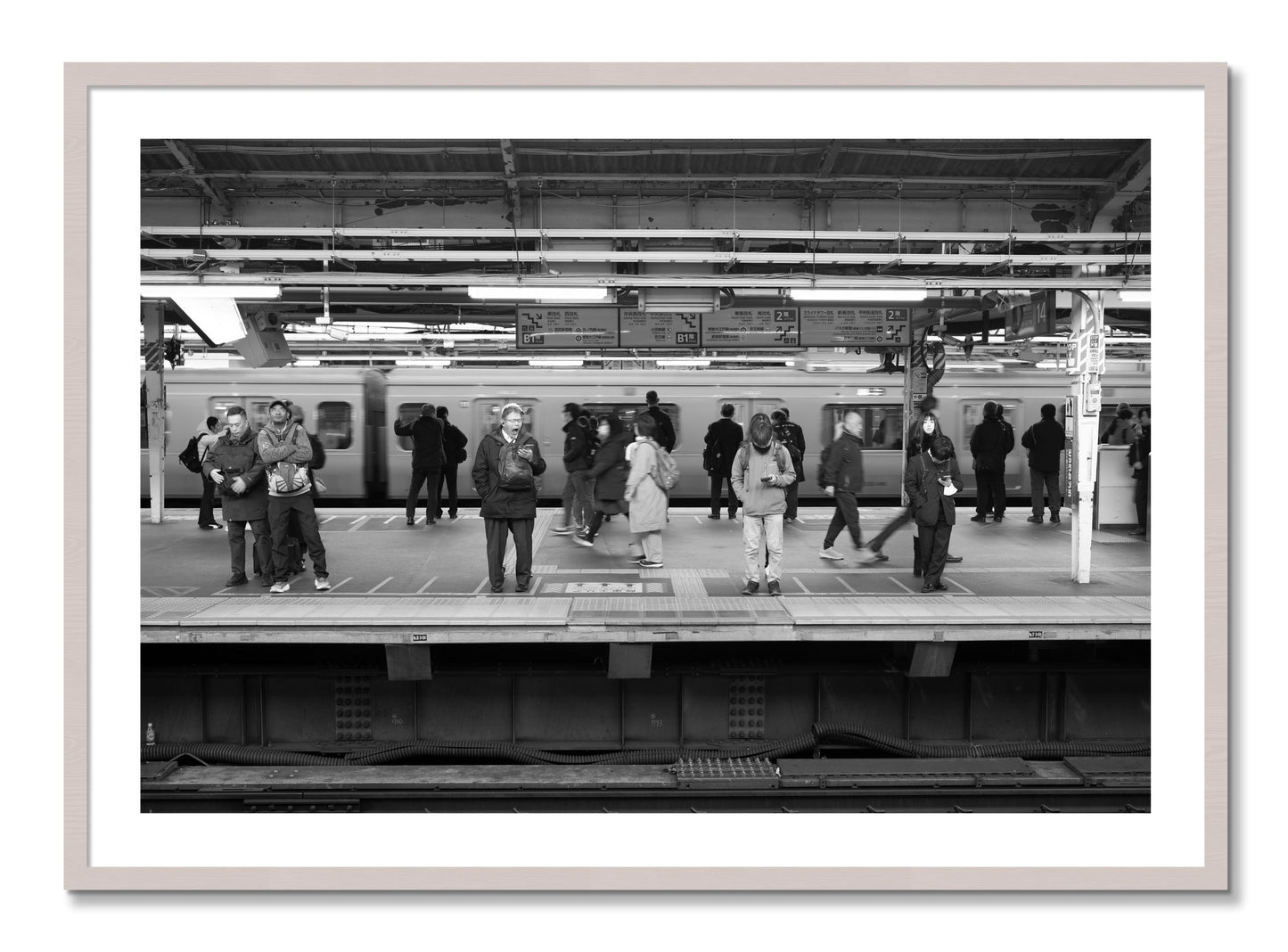 Framed photograph of Tokyo Subway by Dylan Ozanich, White Maple frame, Borders