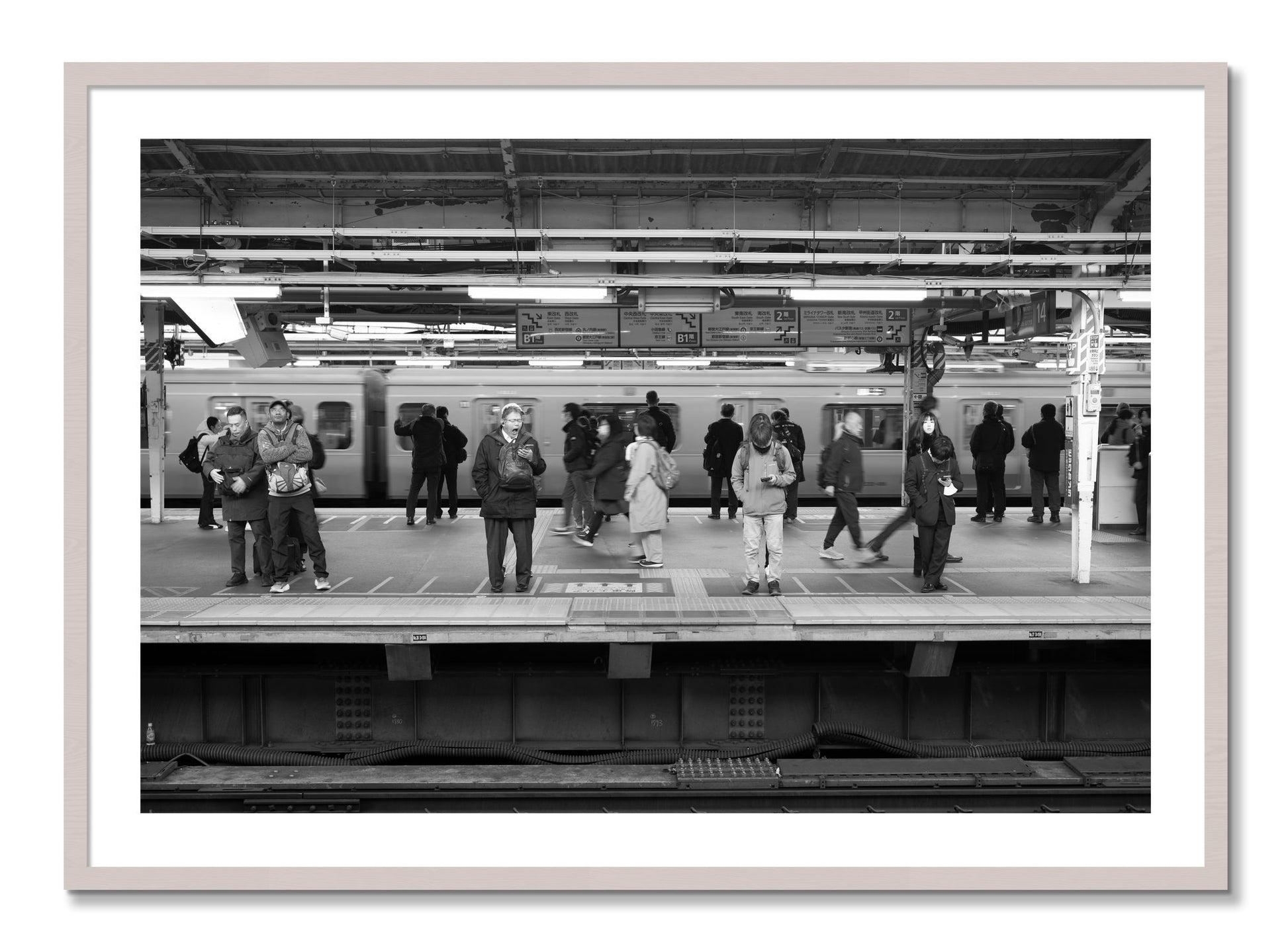 Framed photograph of Tokyo Subway by Dylan Ozanich, White Maple frame, Borders