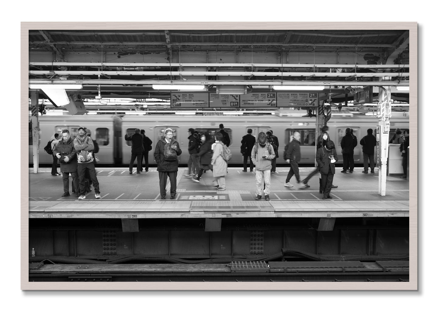 Framed photograph of Tokyo Subway by Dylan Ozanich, White Maple frame, Full Bleed