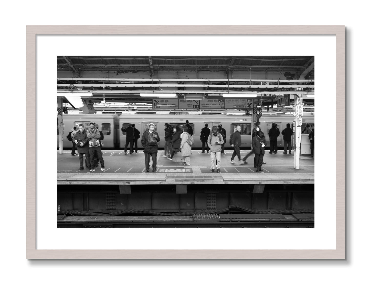 Framed photograph of Tokyo Subway by Dylan Ozanich, White Maple frame, Borders