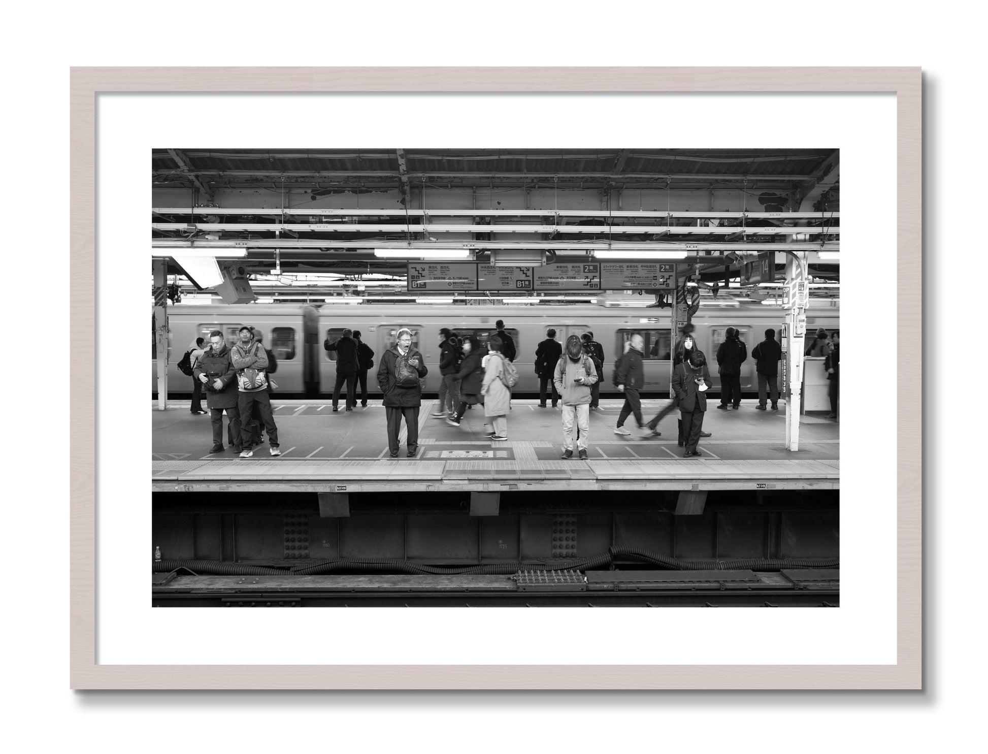 Framed photograph of Tokyo Subway by Dylan Ozanich, White Maple frame, Borders