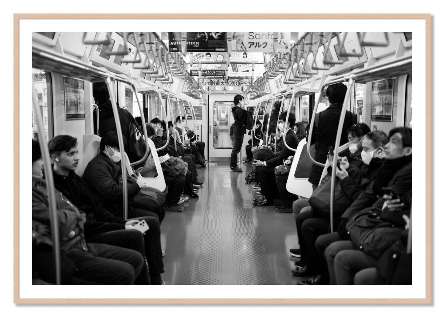 Framed photograph of Tokyo Traincar by Dylan Ozanich, Maple frame, Borders