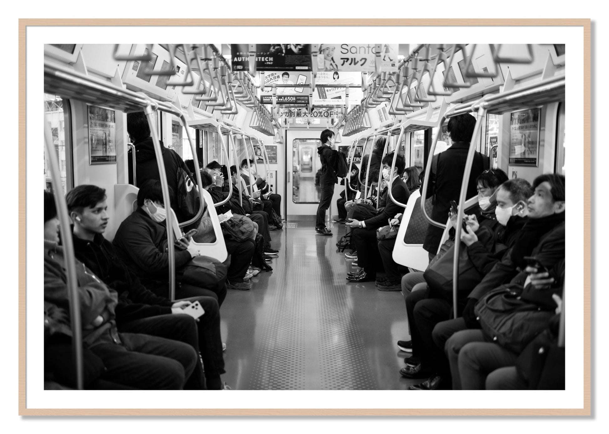Framed photograph of Tokyo Traincar by Dylan Ozanich, Maple frame, Borders