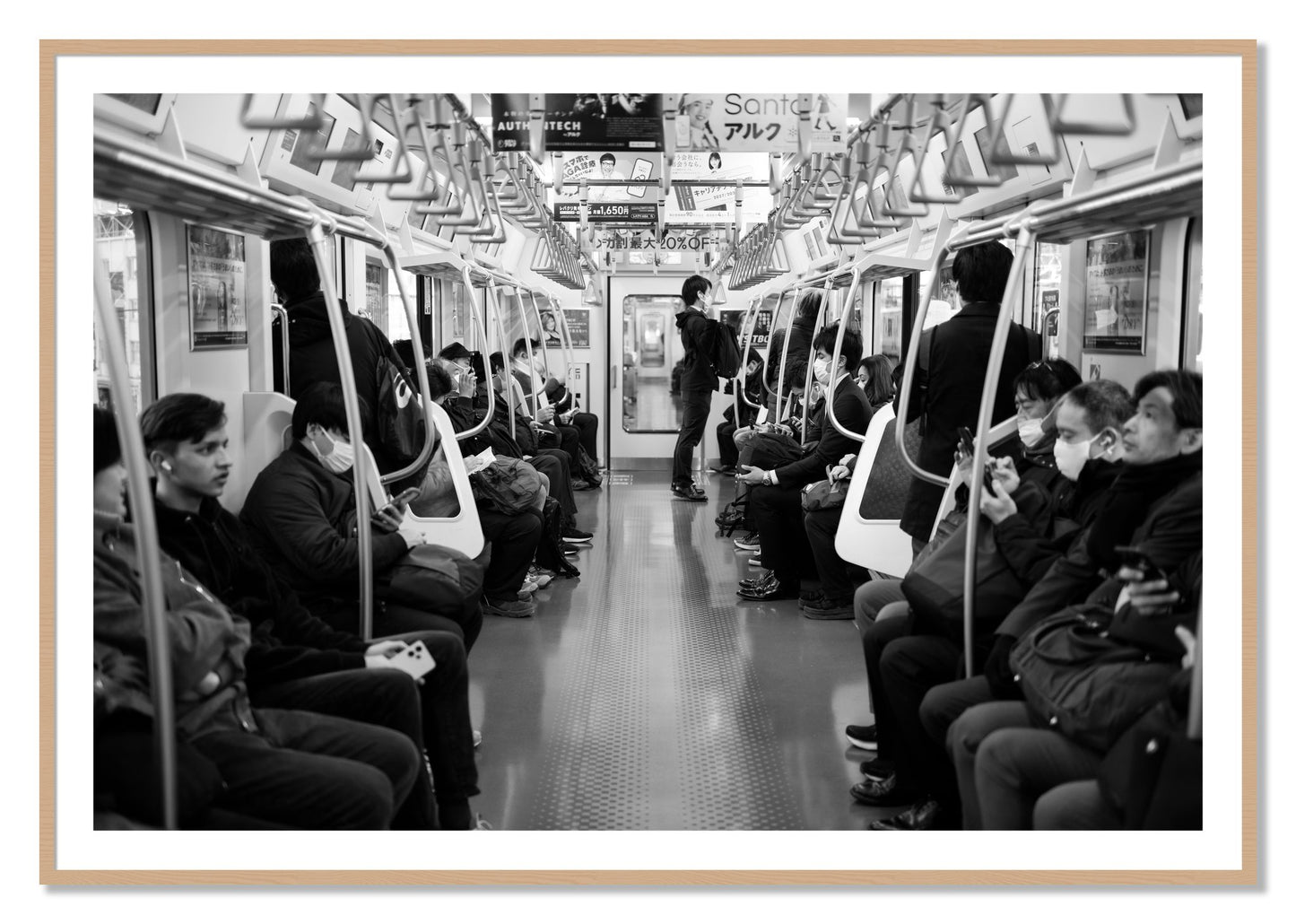 Framed photograph of Tokyo Traincar by Dylan Ozanich, Oak frame, Borders