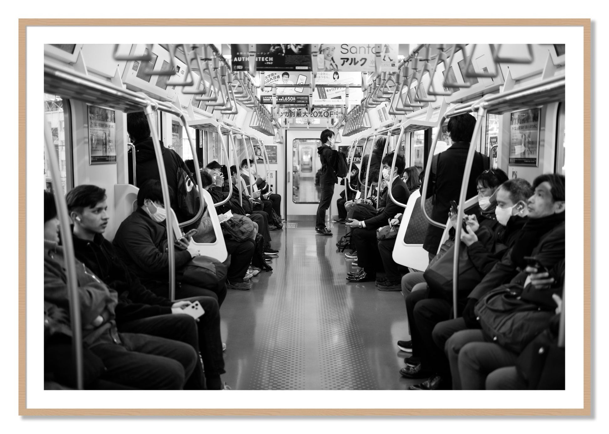 Framed photograph of Tokyo Traincar by Dylan Ozanich, Oak frame, Borders