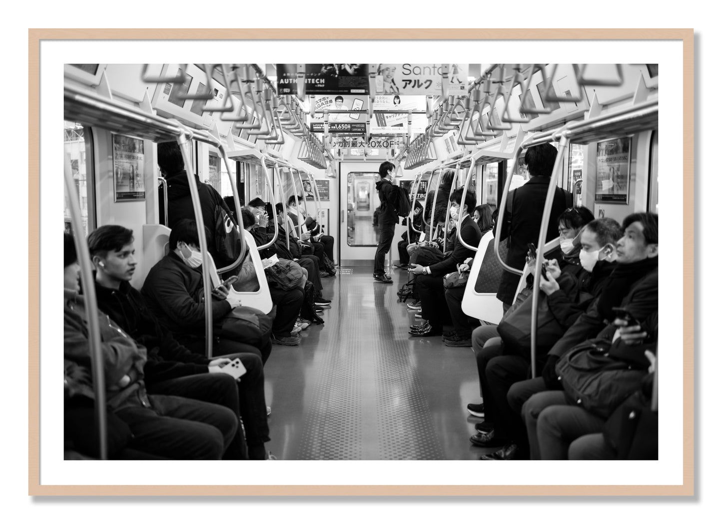 Framed photograph of Tokyo Traincar by Dylan Ozanich, Maple frame, Borders
