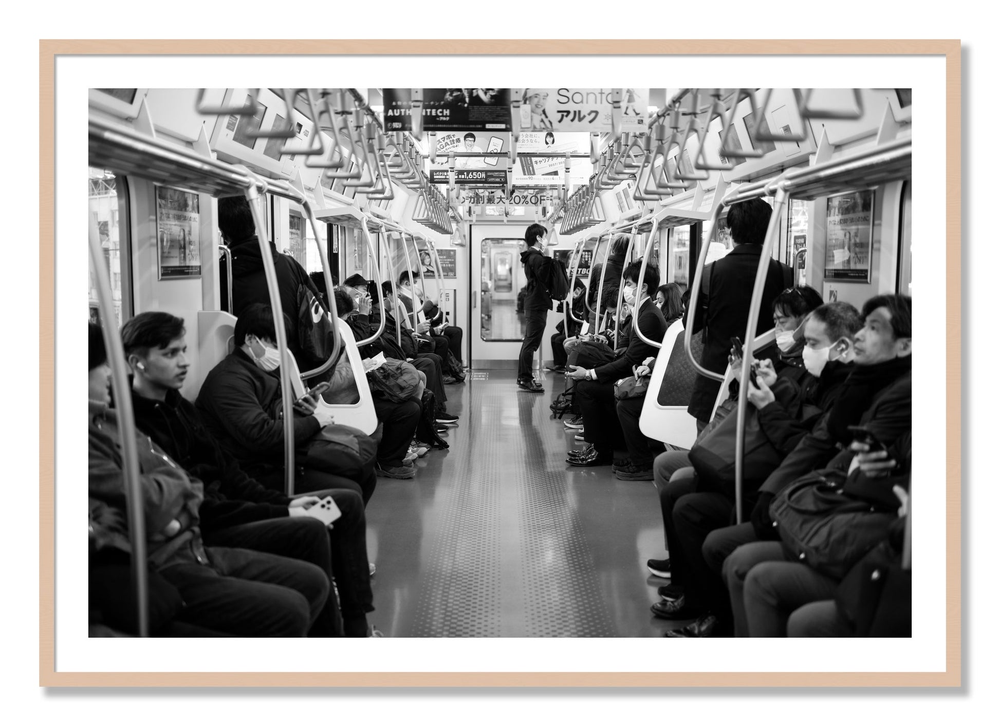 Framed photograph of Tokyo Traincar by Dylan Ozanich, Maple frame, Borders