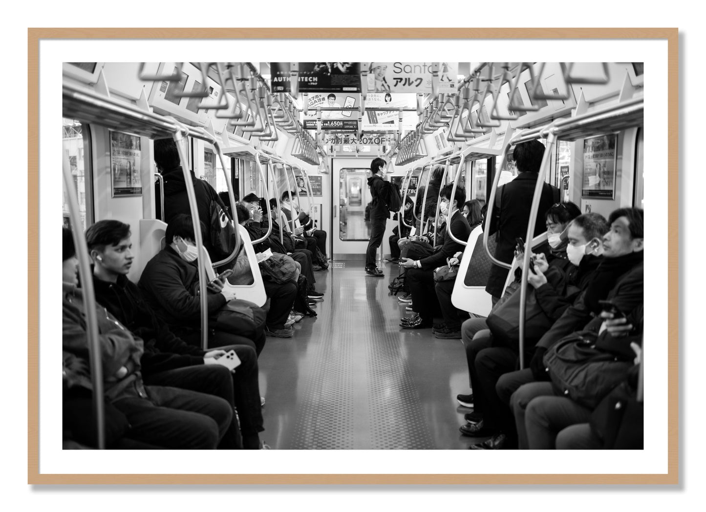 Framed photograph of Tokyo Traincar by Dylan Ozanich, Oak frame, Borders