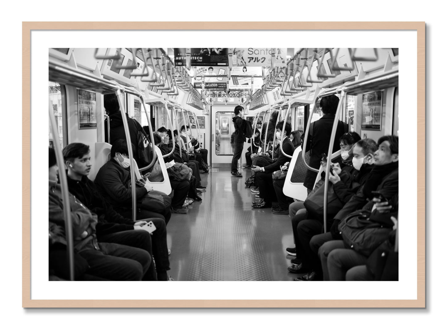 Framed photograph of Tokyo Traincar by Dylan Ozanich, Maple frame, Borders