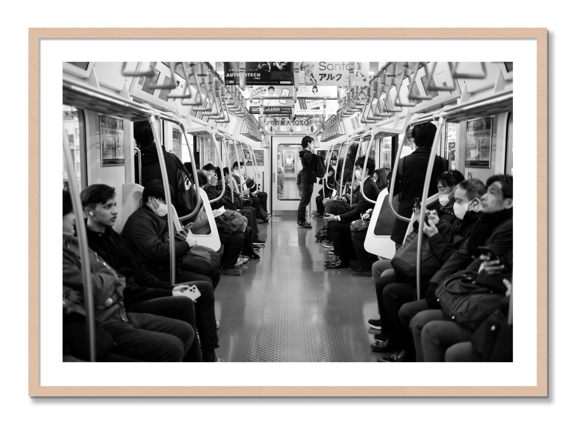 Framed photograph of Tokyo Traincar by Dylan Ozanich, Maple frame, Borders