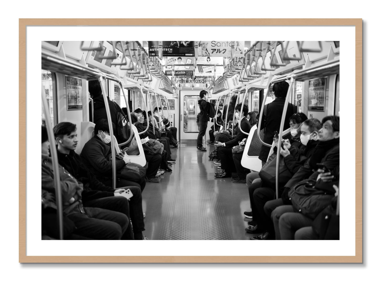 Framed photograph of Tokyo Traincar by Dylan Ozanich, Oak frame, Borders