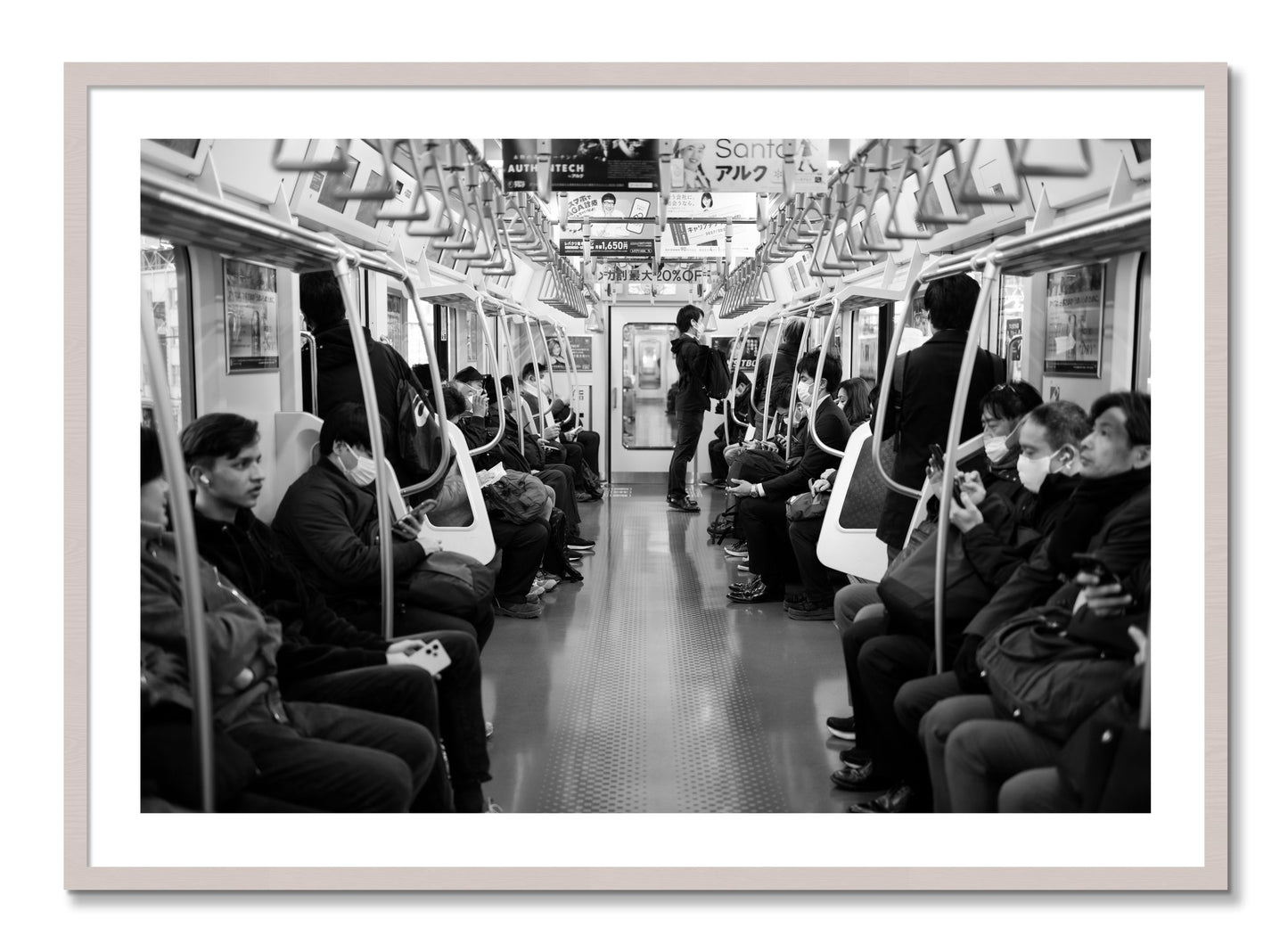 Framed photograph of Tokyo Traincar by Dylan Ozanich, White Maple frame, Borders