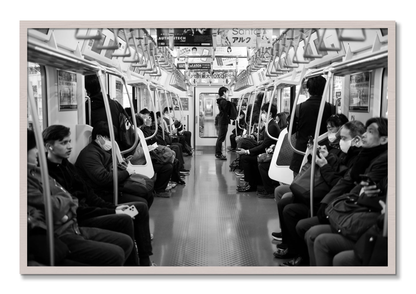 Framed photograph of Tokyo Traincar by Dylan Ozanich, White Maple frame, Full Bleed