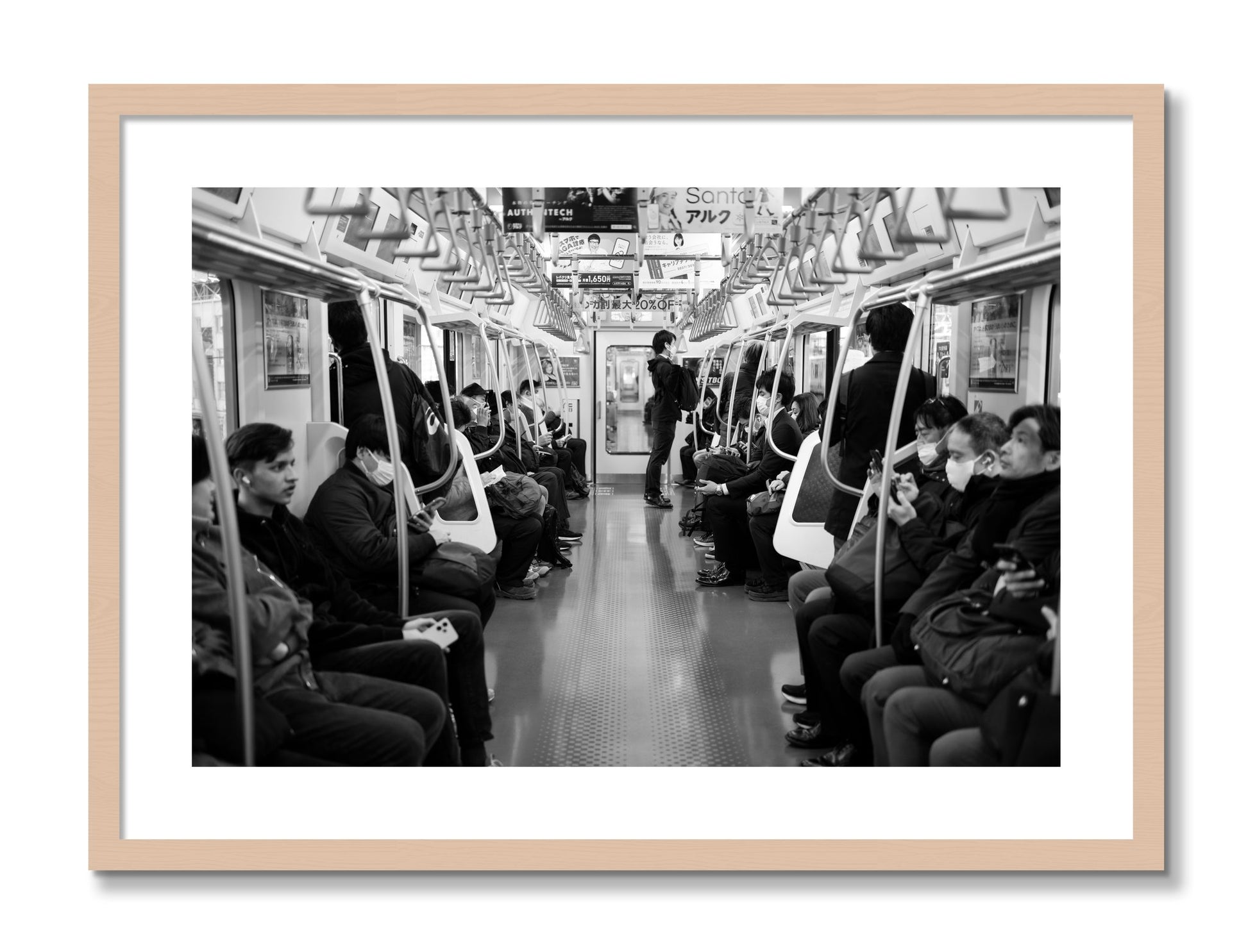 Framed photograph of Tokyo Traincar by Dylan Ozanich, Maple frame, Borders