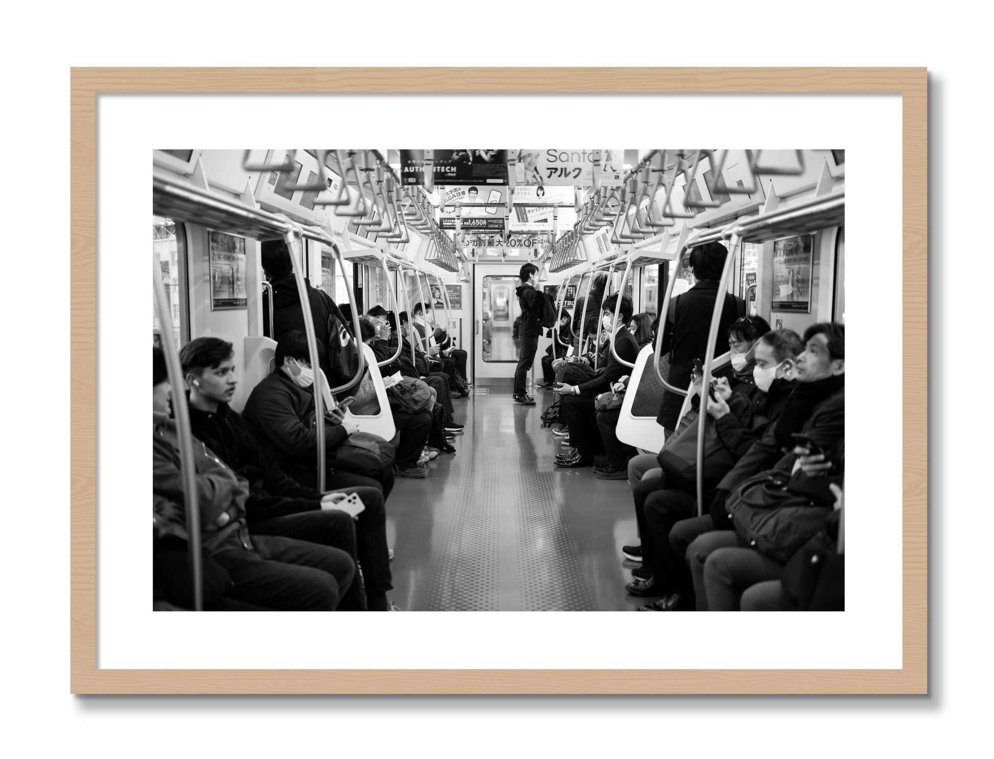 Framed photograph of Tokyo Traincar by Dylan Ozanich, Oak frame, Borders