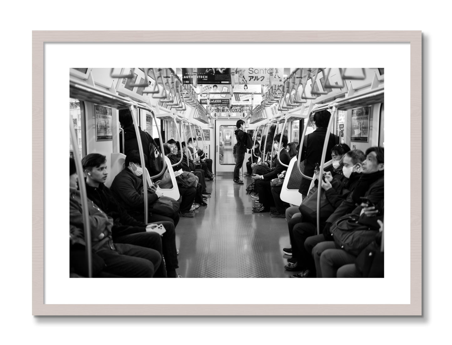 Framed photograph of Tokyo Traincar by Dylan Ozanich, White Maple frame, Borders