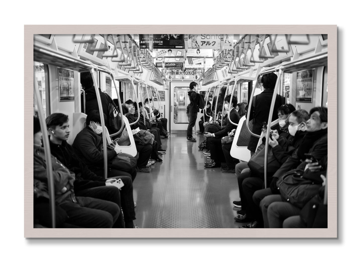 Framed photograph of Tokyo Traincar by Dylan Ozanich, White Maple frame, Full Bleed