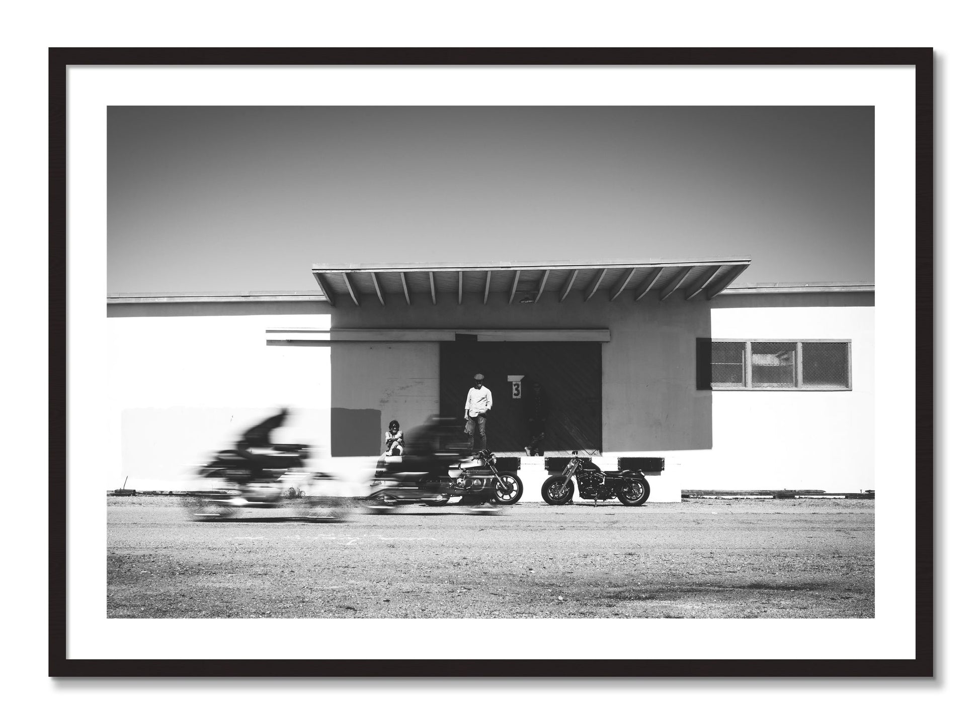 Framed photograph of Treasure Island Racing by Dylan Ozanich, Black Walnut frame, Borders